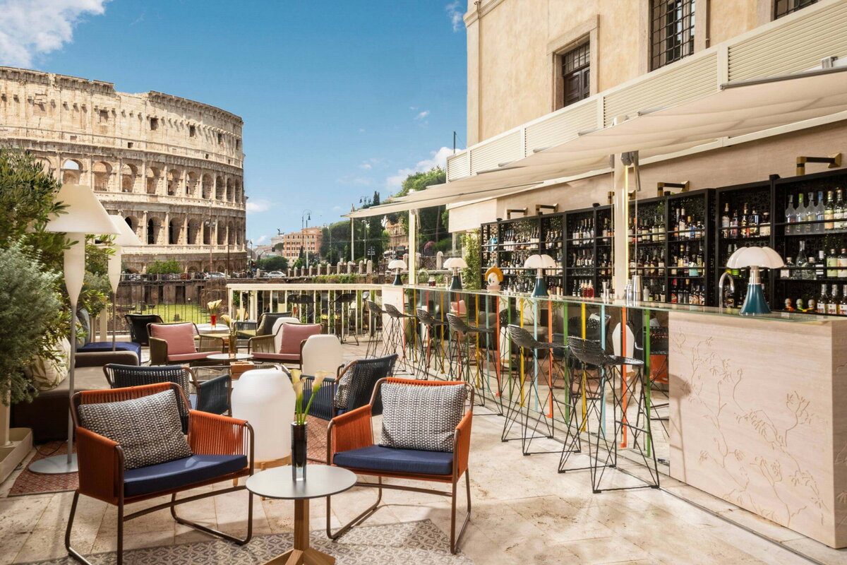 The Court Bar at palace hotel Palazzo Manfredi overlooking Rome Colosseum and Ludus Magnus gladiator training ruins