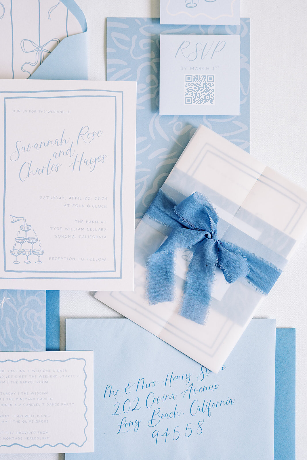 blue-invite-suite-flatlay-with-bow