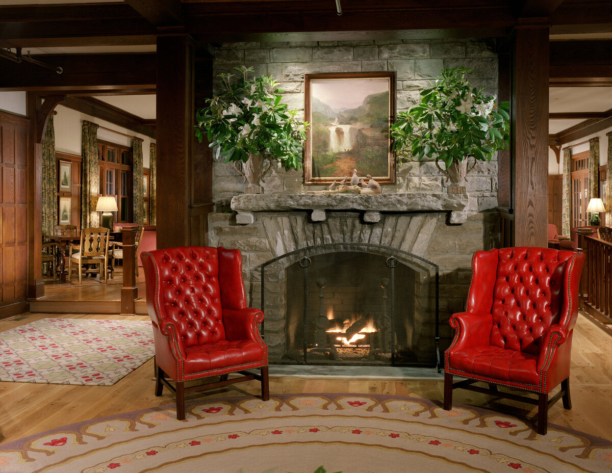 Eseeola Lodge sitting in front of fireplace