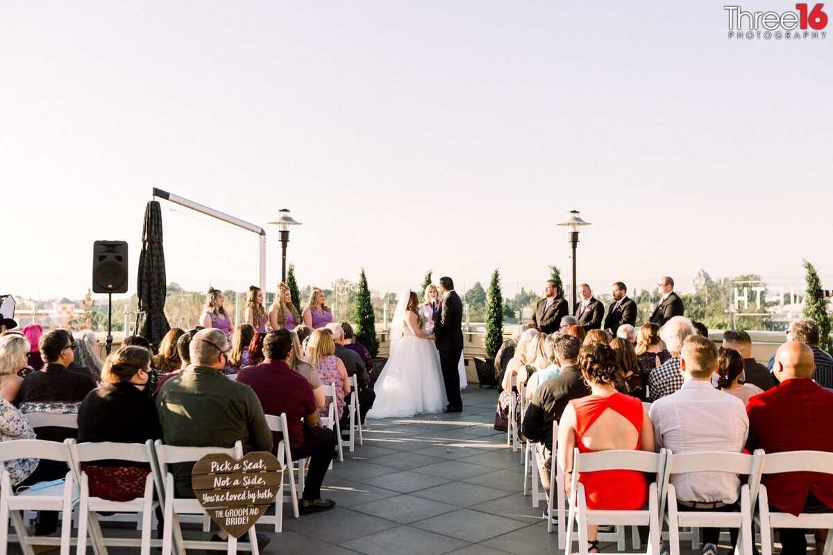 Bride and Groom saying their vows during their outdoor ceremony