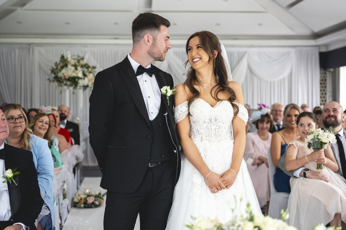 Stood next to each other in the ceremony