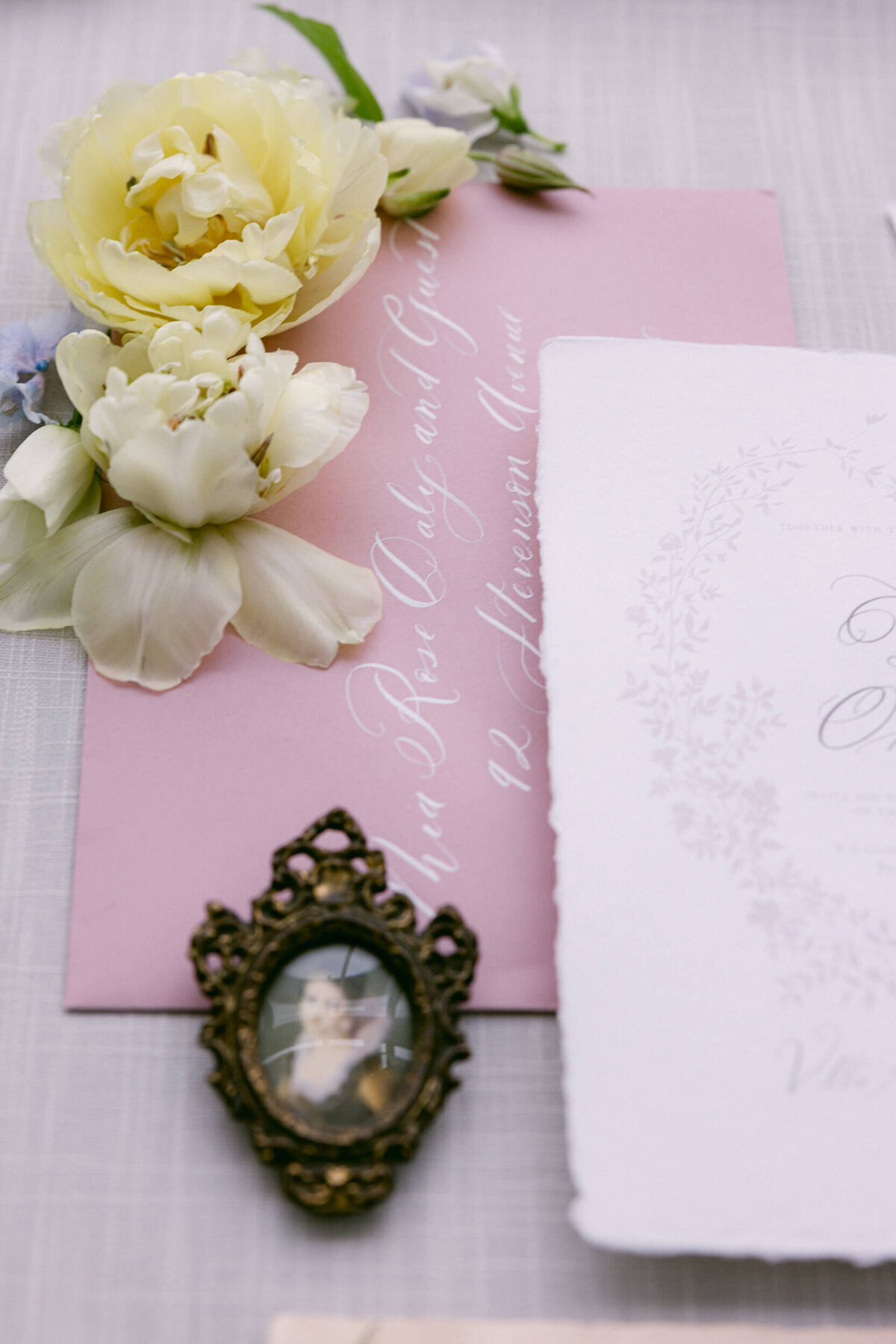 A wedding day photo of the brides wedding invitations at Villa Aura del Lago on Lake Como in Italy