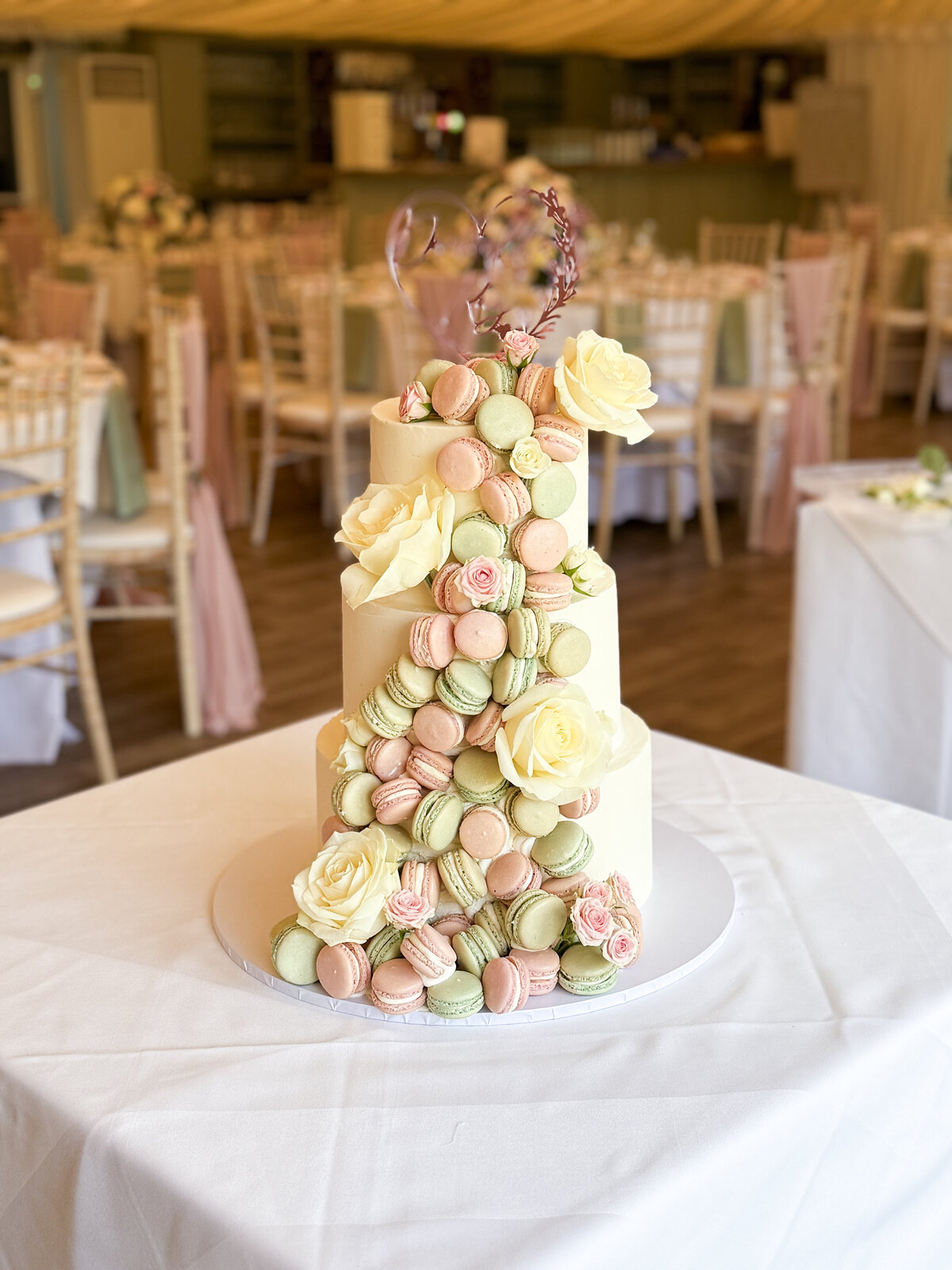layers-graces-three-tier-wedding-cake-buttercream-macarons-cascade-wow-factor-pink-fresh-flowers-sage-green