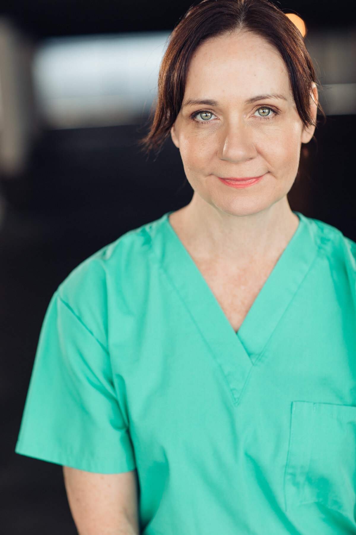 Headshot Photograph Of Woman In Mint Green Hospital Uniform Los Angeles