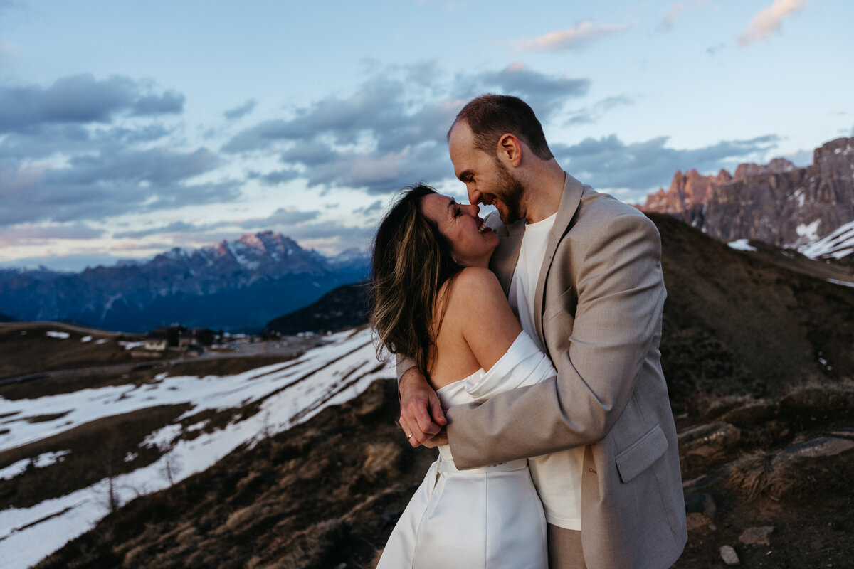 romantic couple during twilight elopement in Dolomites