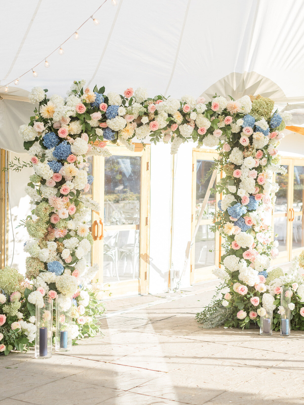 Kate-Murtaugh-Events-Newport-wedding-floral-arch-tent-entrance-Castle-Hill-Inn