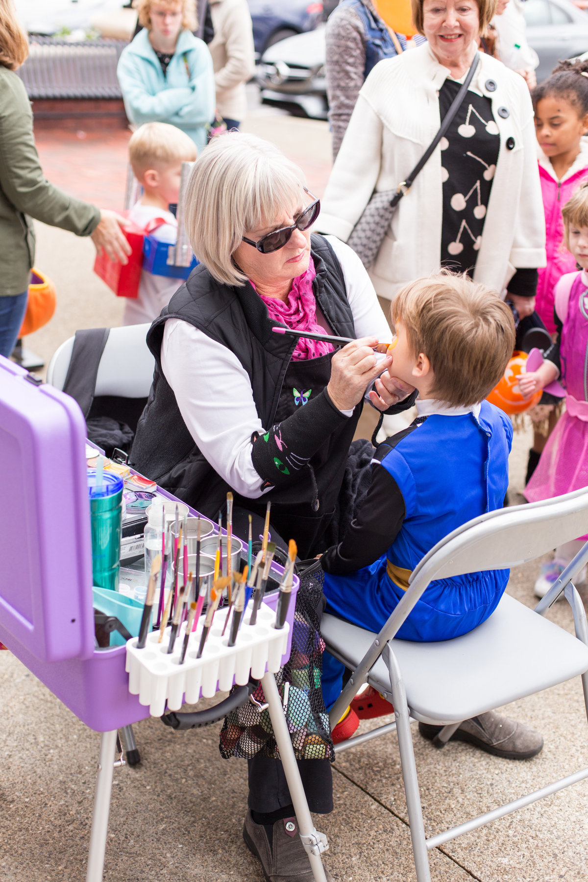 Face painting during Fall Hallowing children event by Laure Photography