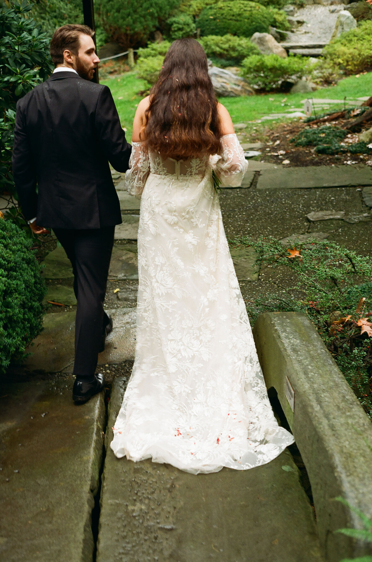 couple walking through garden