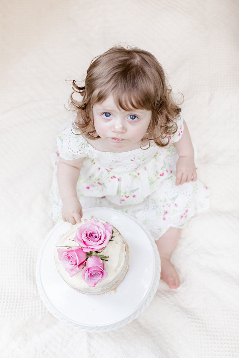 one-year-old-girl-with-cake