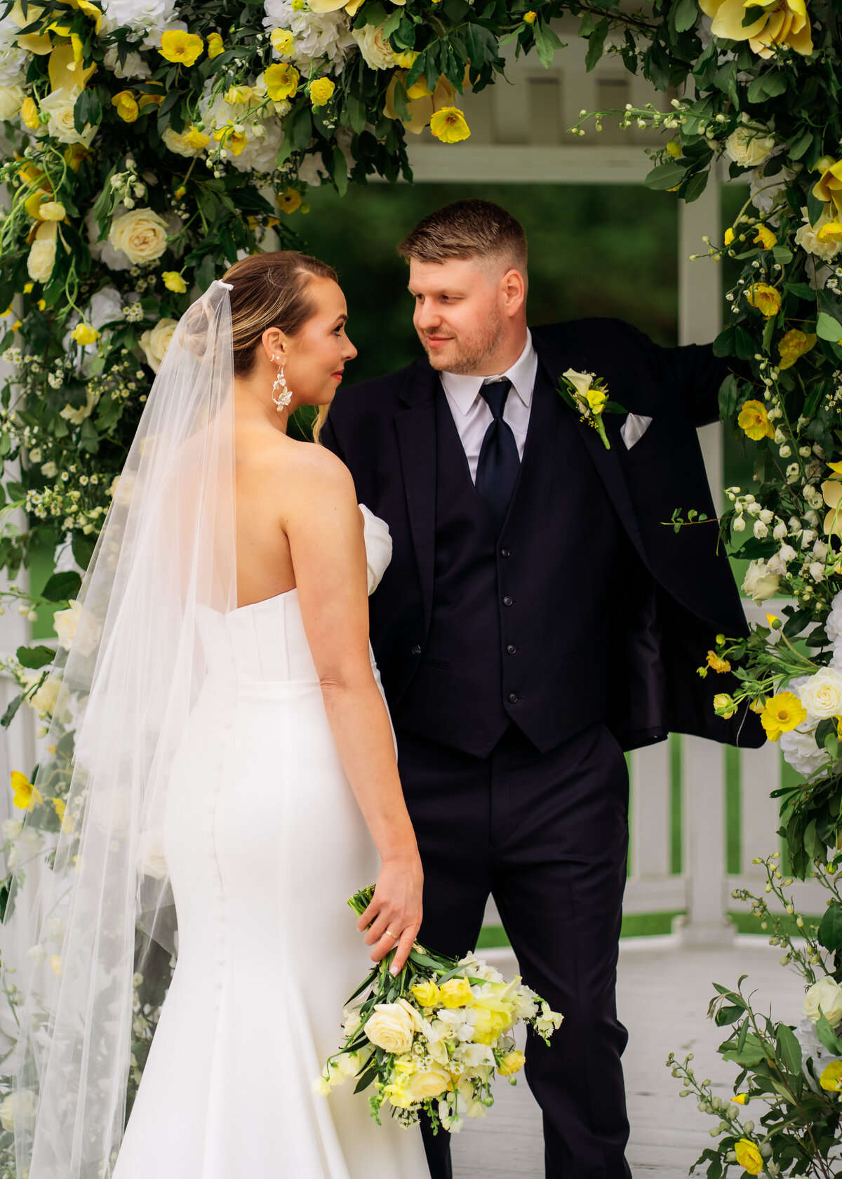 brides and groom posed couples photos on their wedding day at the Chateau at White Oak Des Moines Iowa wedding venue