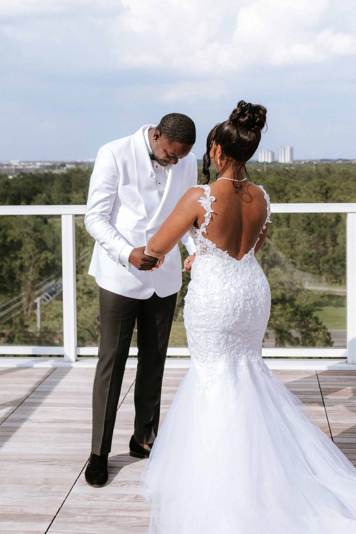 This heartfelt rooftop first look features a beautiful Black couple captured by Phavy Photography, a Jacksonville wedding photographer. The groom’s emotional reaction and the bride’s elegant lace gown are highlighted against a scenic skyline backdrop. With a blend of documentary storytelling and luxury editorial style, Phavy Photography preserves powerful, authentic moments for modern weddings in Jacksonville.