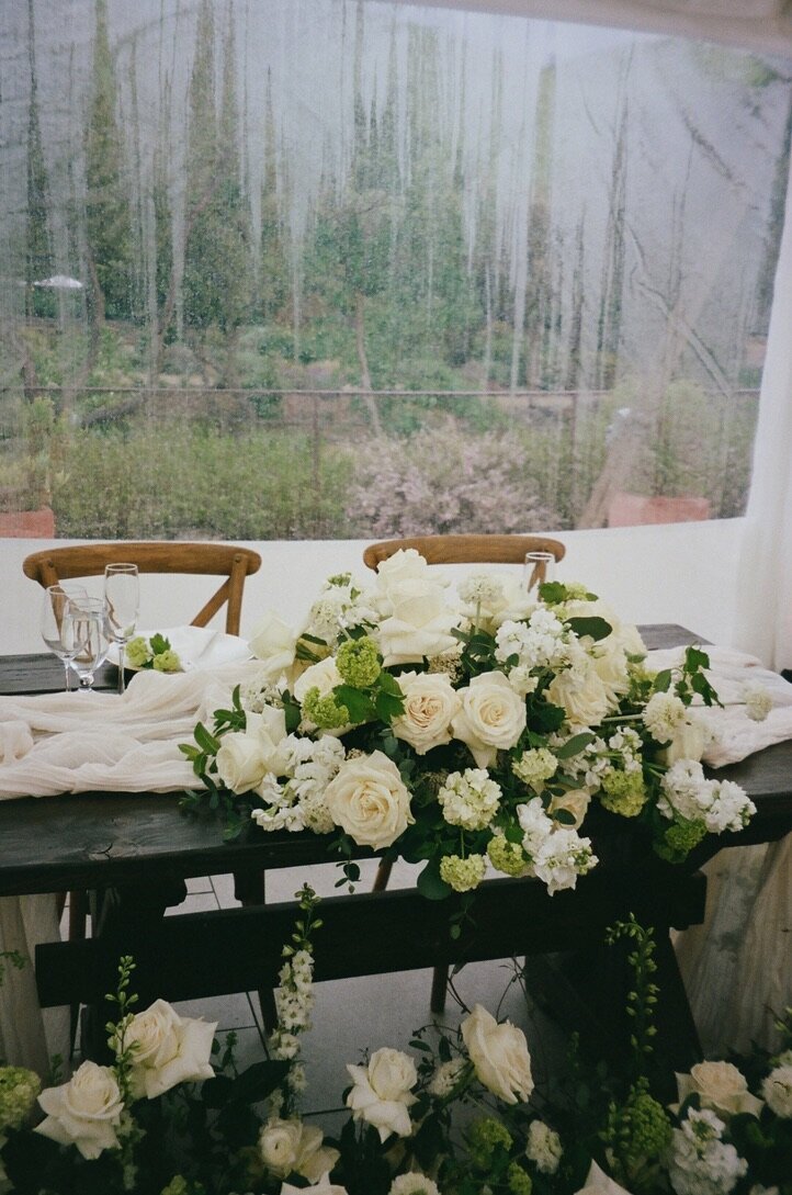 Sweetheart table, white roses, snow balls, garden roses, tent wedding