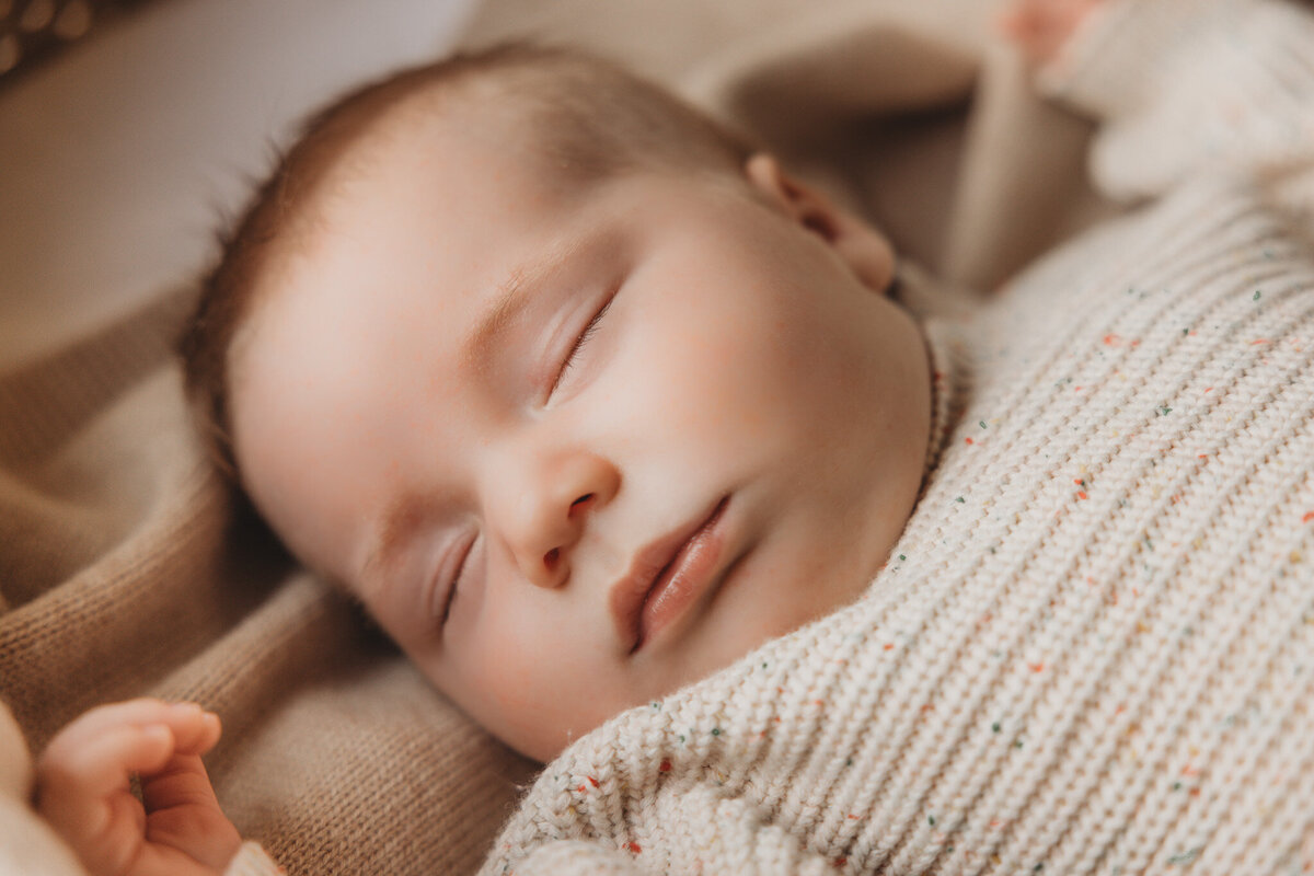 newborn baby posing during newborn photoshoot captured by Bie