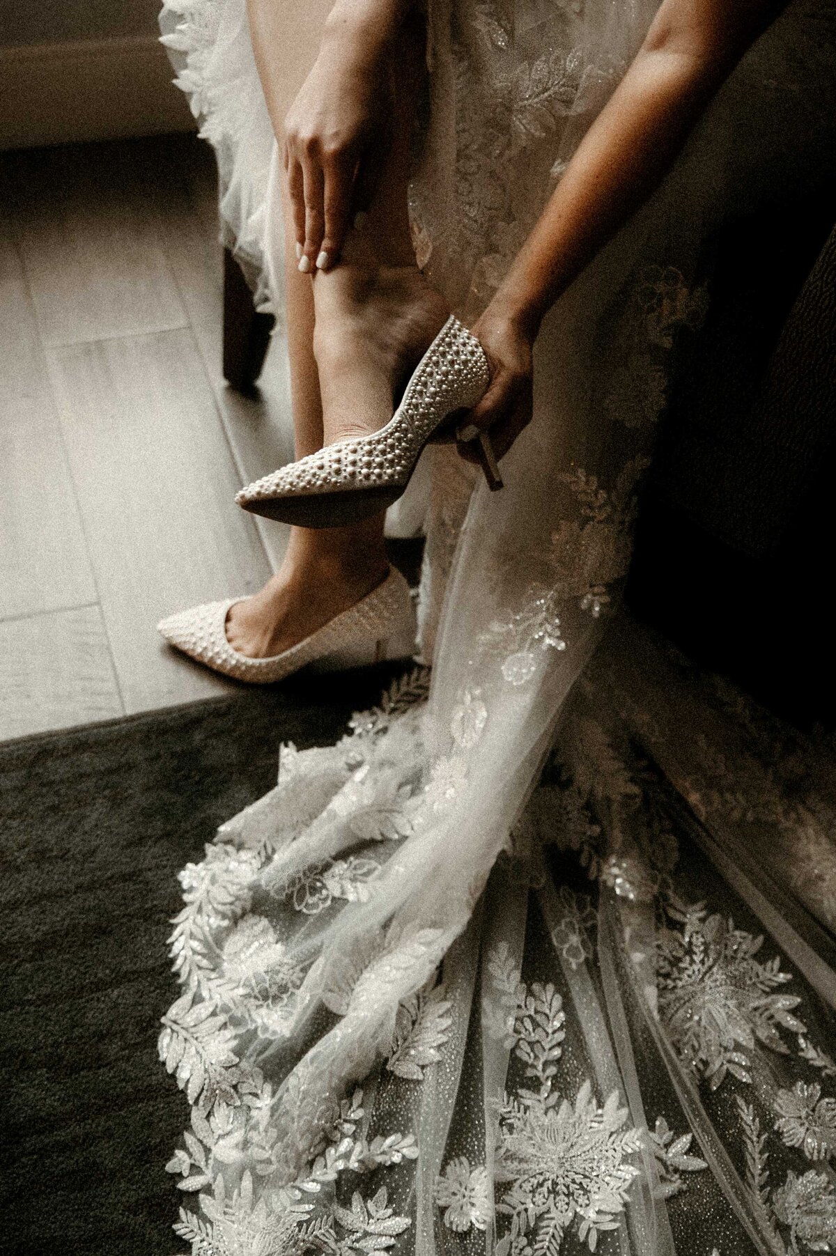 bride-putting-on-shoes-hotel-st-louis-missouri