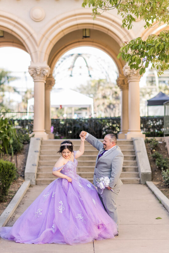 father-twirling-daughter-balboa-park
