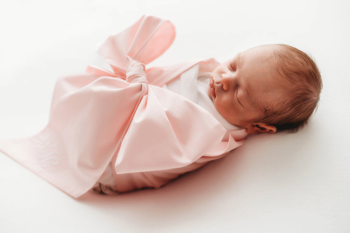 Newborn swaddled for photos during Newborn Photoshoot.