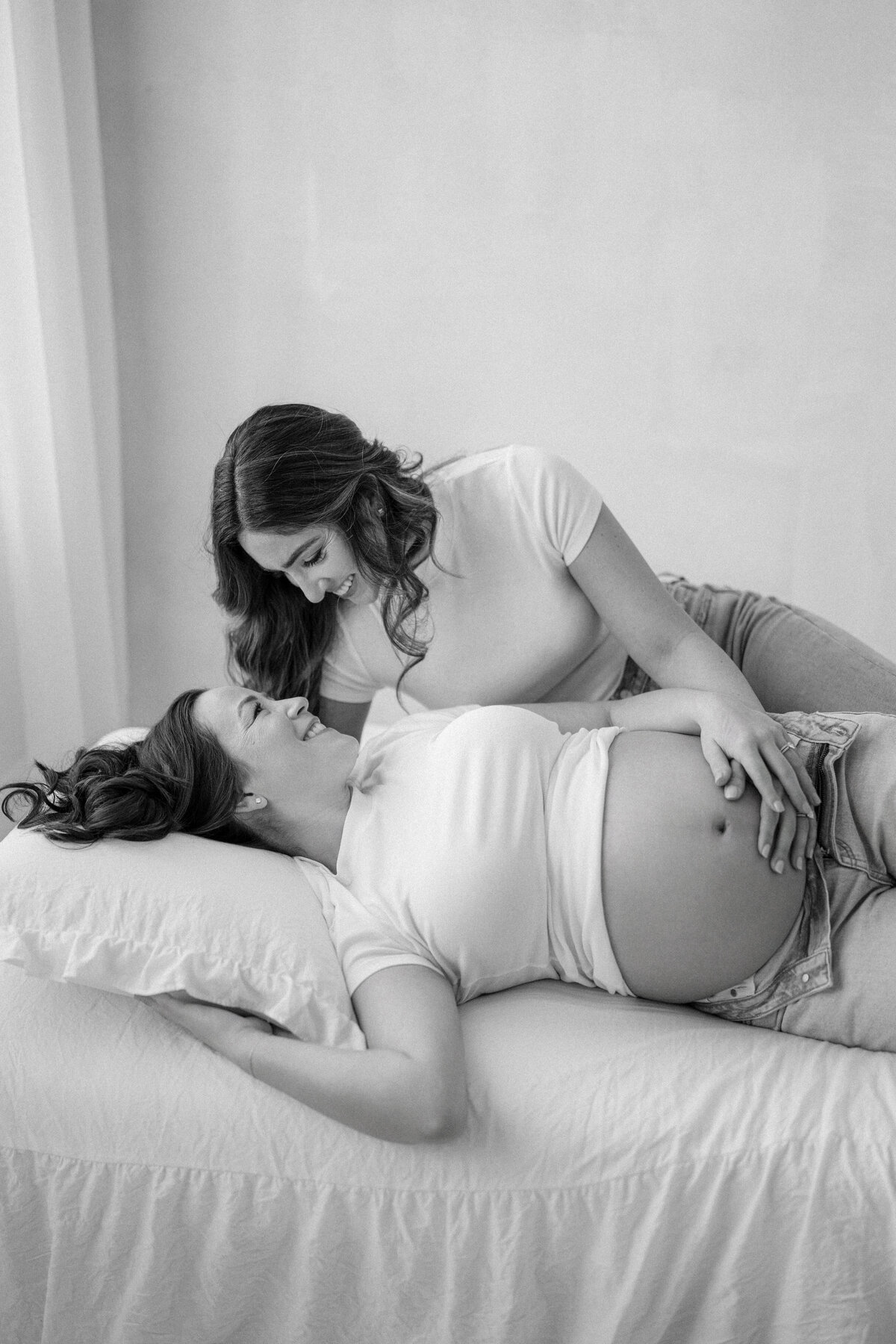 Elegant maternity portrait of Lori and Christina in Tampa natural light studio