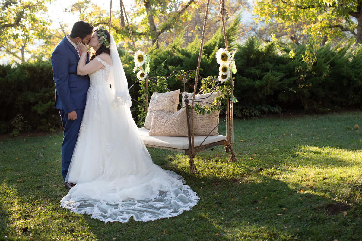 bride and groom with swing