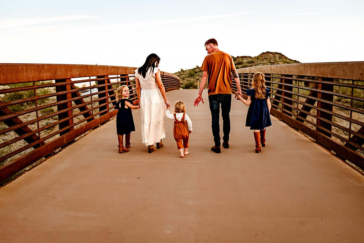 Arizona family crossing bridge during photography sesion
