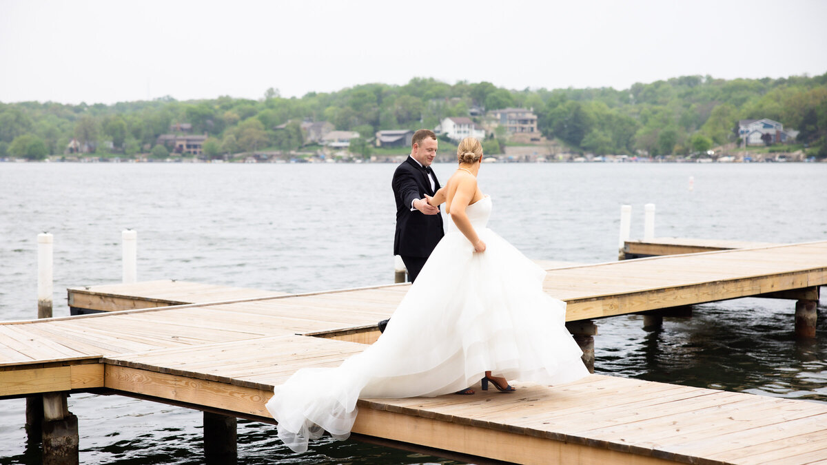 Bride and Groom on dock of Lake Quivira