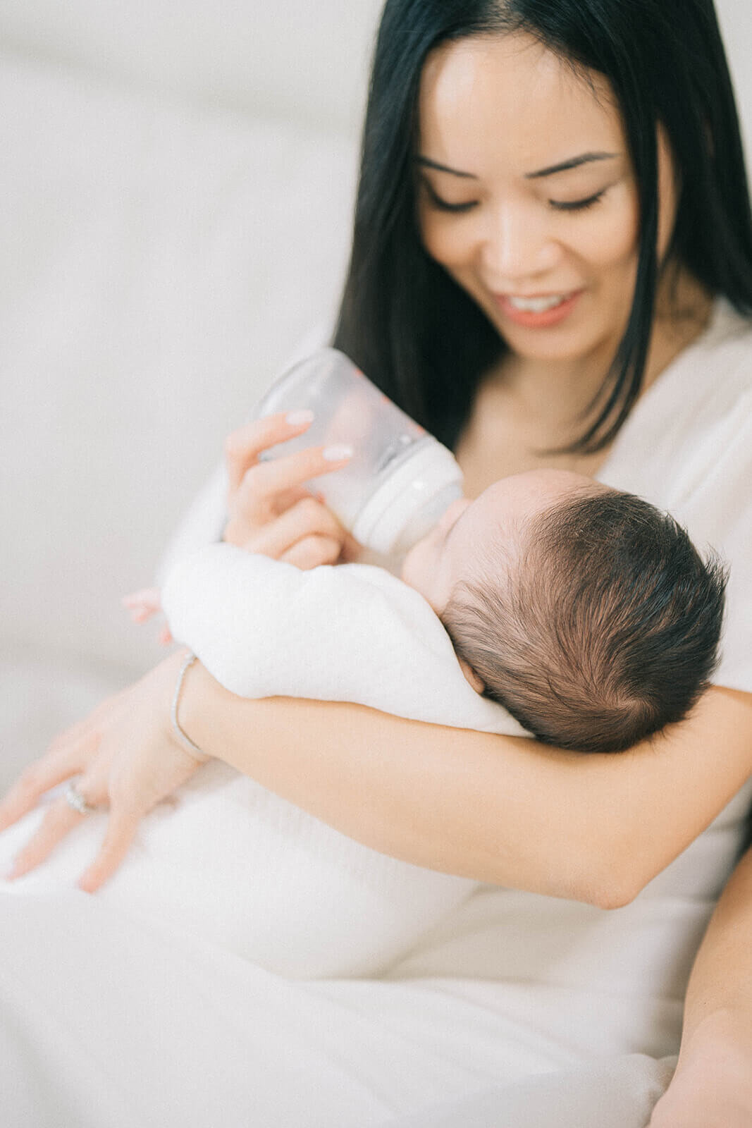 Mother-bottle-feeding-newborn-baby