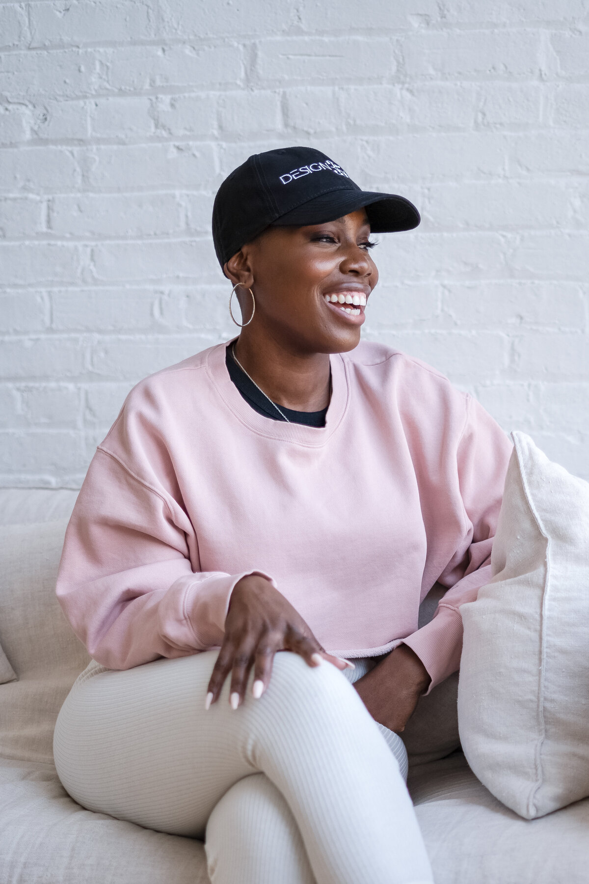 A branding portrait showing the artist in a candid laugh, highlighting her personality and authenticity. This close-up moment adds intimacy to the visual narrative of her brand.