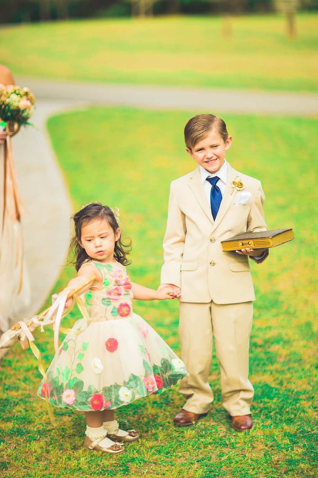 Wedding Photograph Of a Boy Holding a Book and a Little Girl Los Angeles