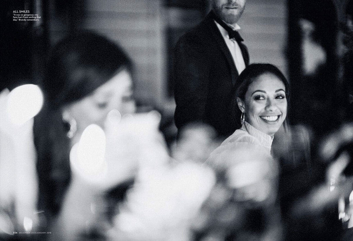 The bride is smiling while dining with the guests in a Lake Como wedding. Brides Magazine image by Jenny Fu Studio