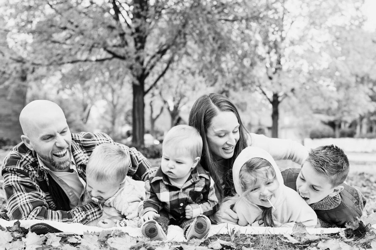 Large family laughing at Chicago photography session by Everything is Grace.