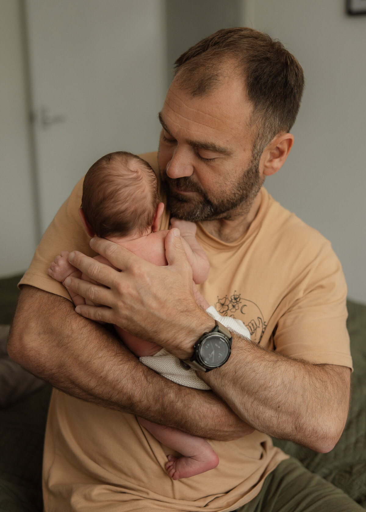 portait of newborn baby with father