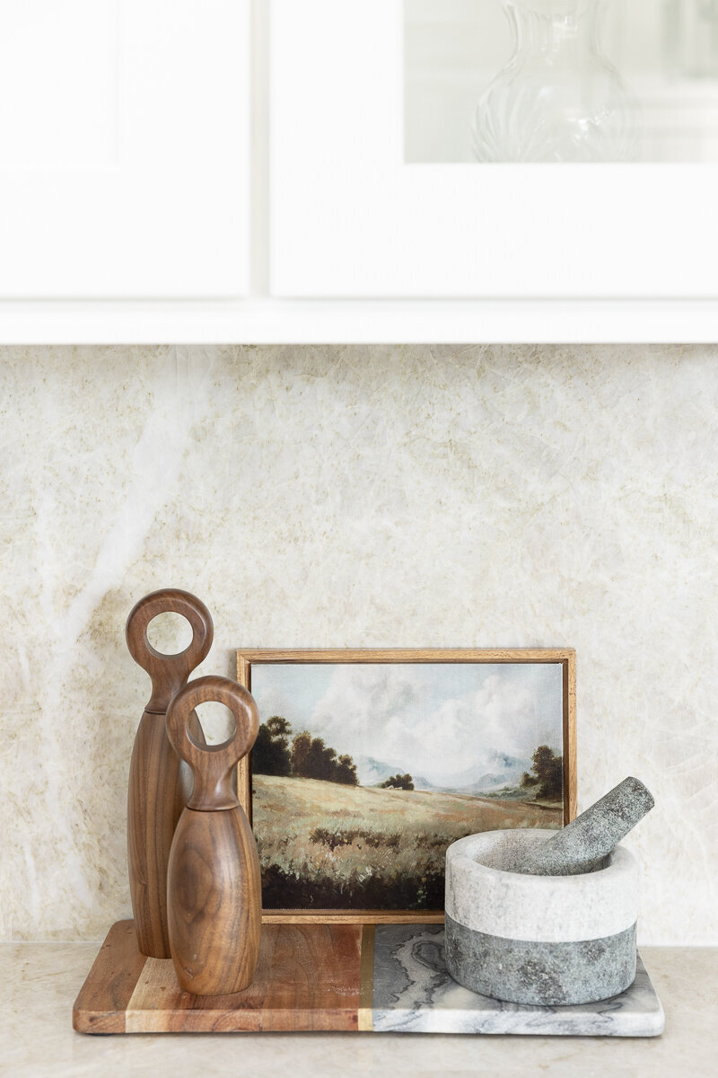 dewine design orlando interior designer windermere full home renovation kitchen counter picture frame and spice muddler