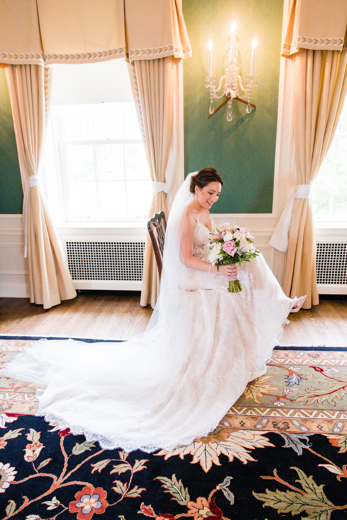 bride posing for photo in the bridal suite in the fcgc before wedding ceremony