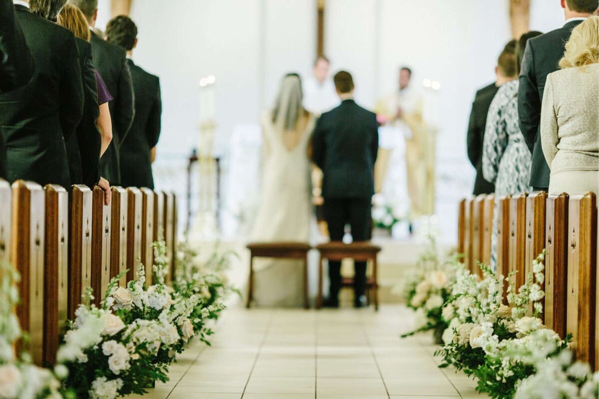 Stunning Floral Aisle for a Classic Church Ceremony at a Luxury Michigan Lakefront Golf Club Wedding.