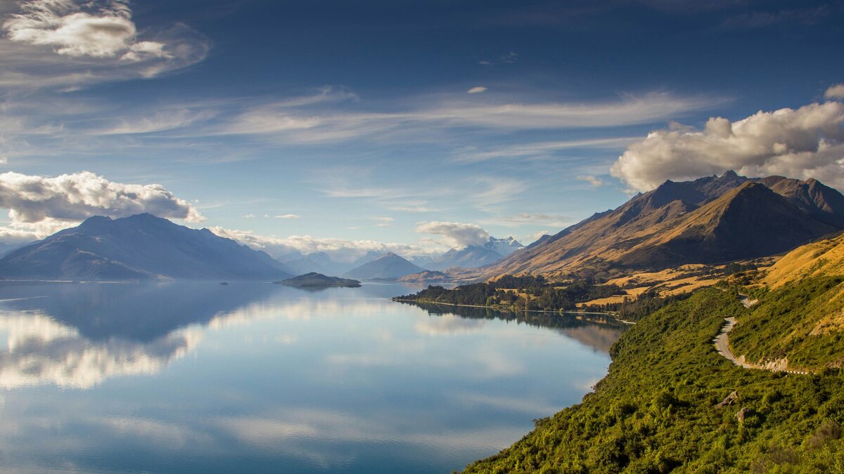 Looking over Lake Wakatipu towards Glenorchy with the hillside and road to the side.