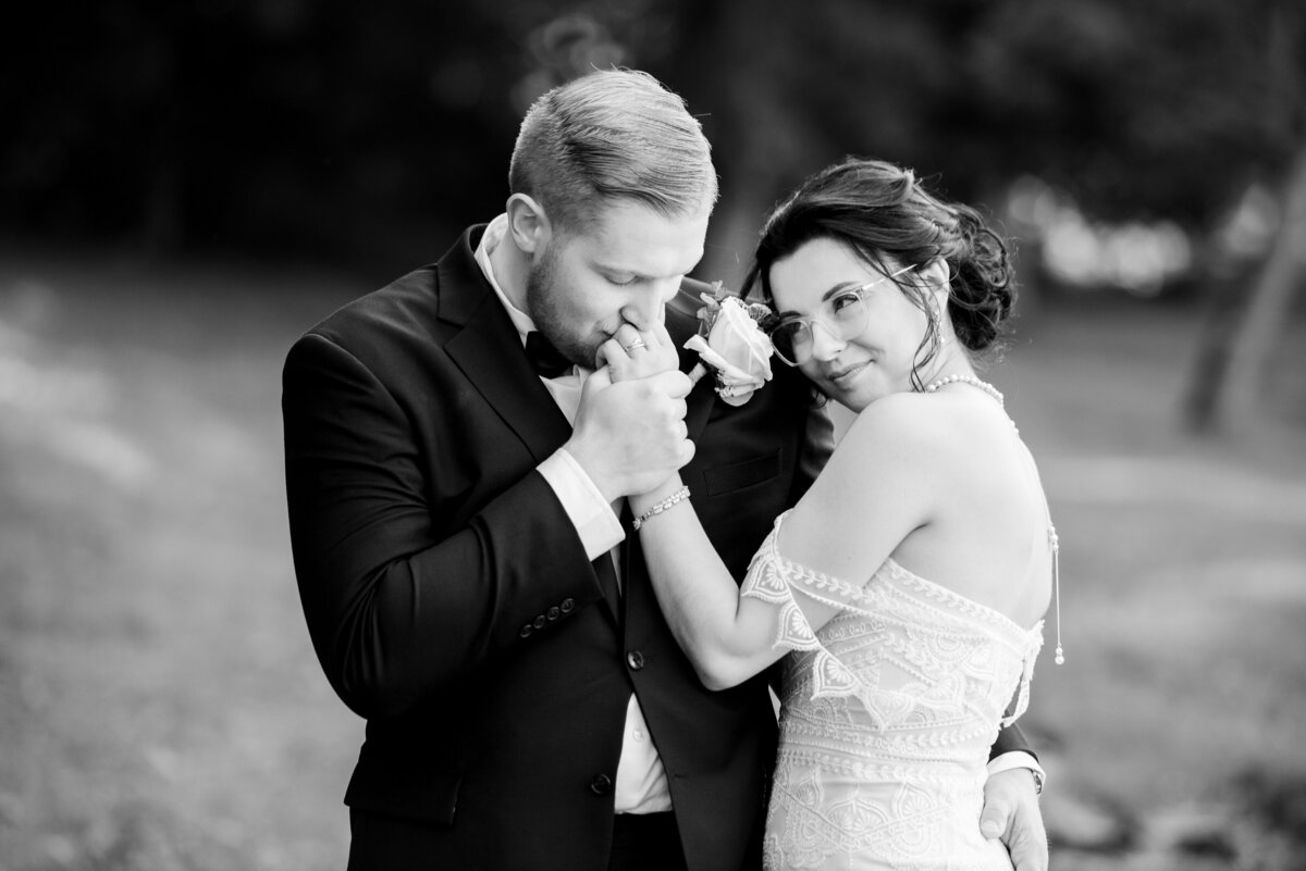 Groom and bride embrace one another during a private moment on their wedding day in Ohio. Photographed by Aaron Aldhizer