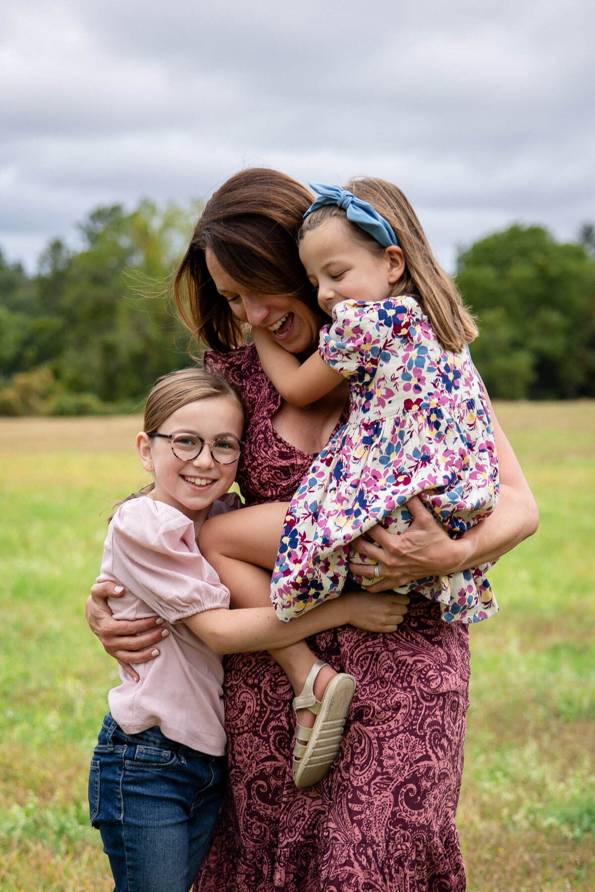 Photo of mom and daughters during fall family photo session
