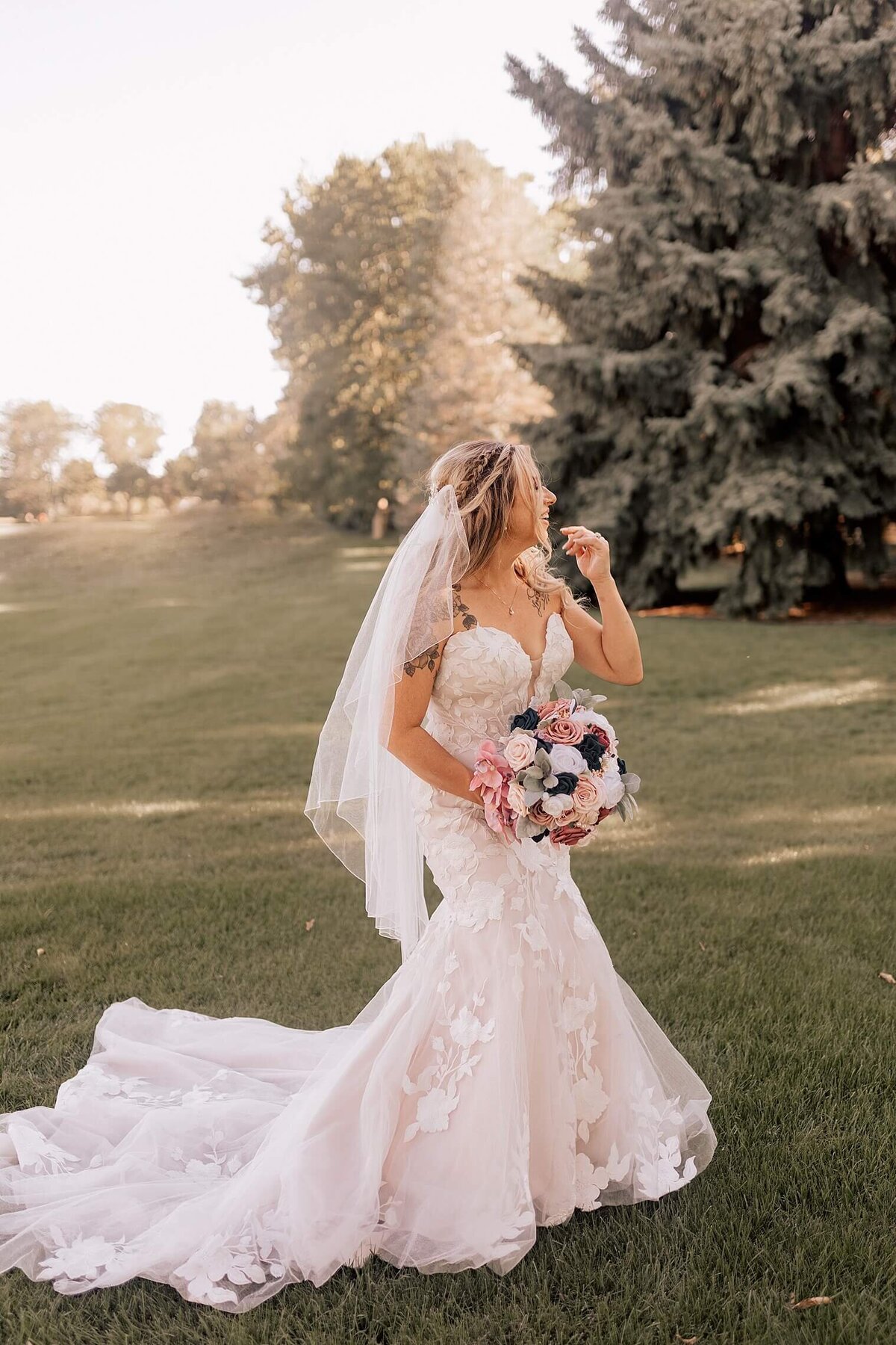 Colorado Wedding day bride being photographed smiling looking to the side