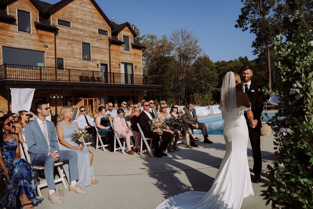 bride and groom under the altar at wedding ceremony
