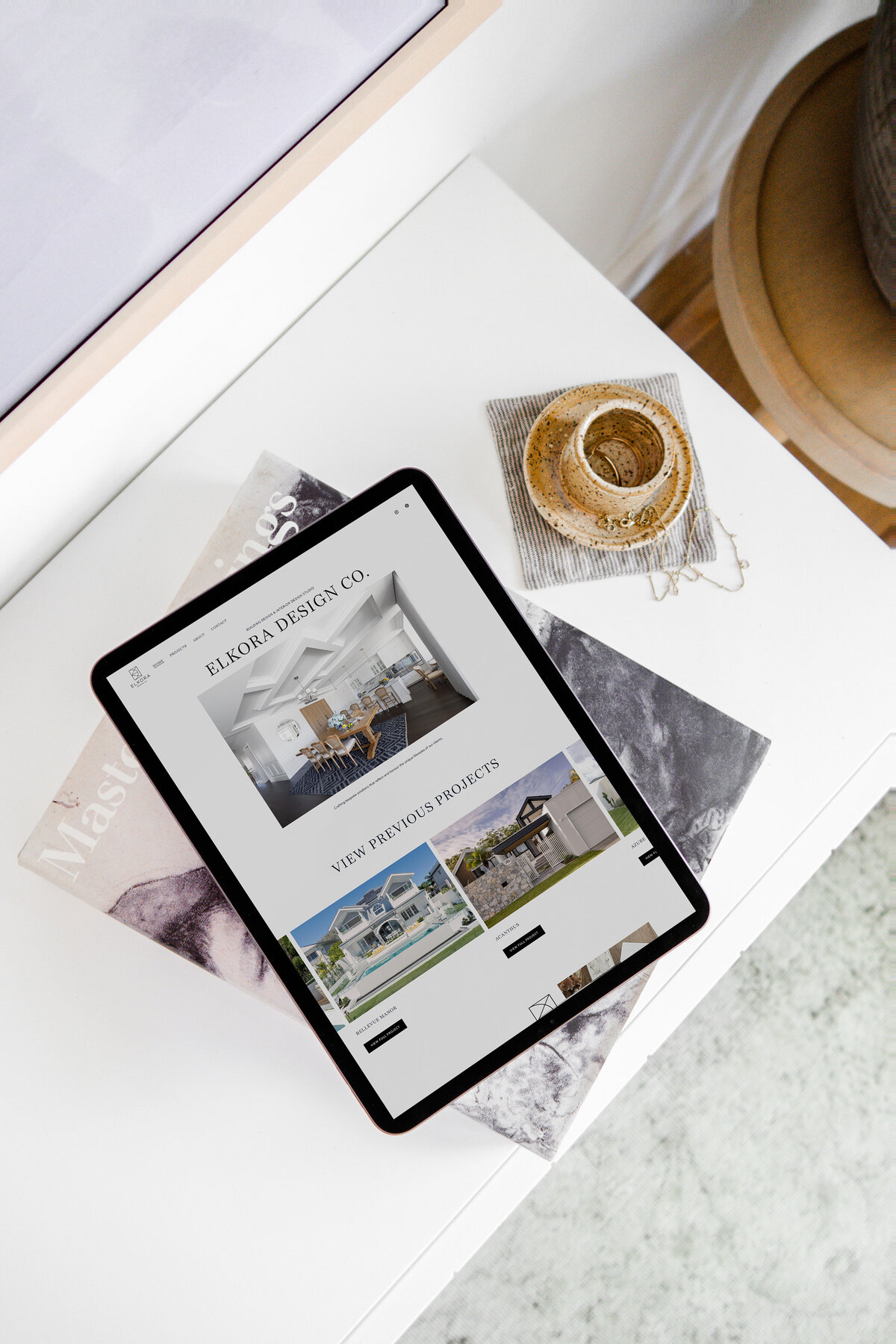 showit website design mockup of a construction company in a laptop on a counter