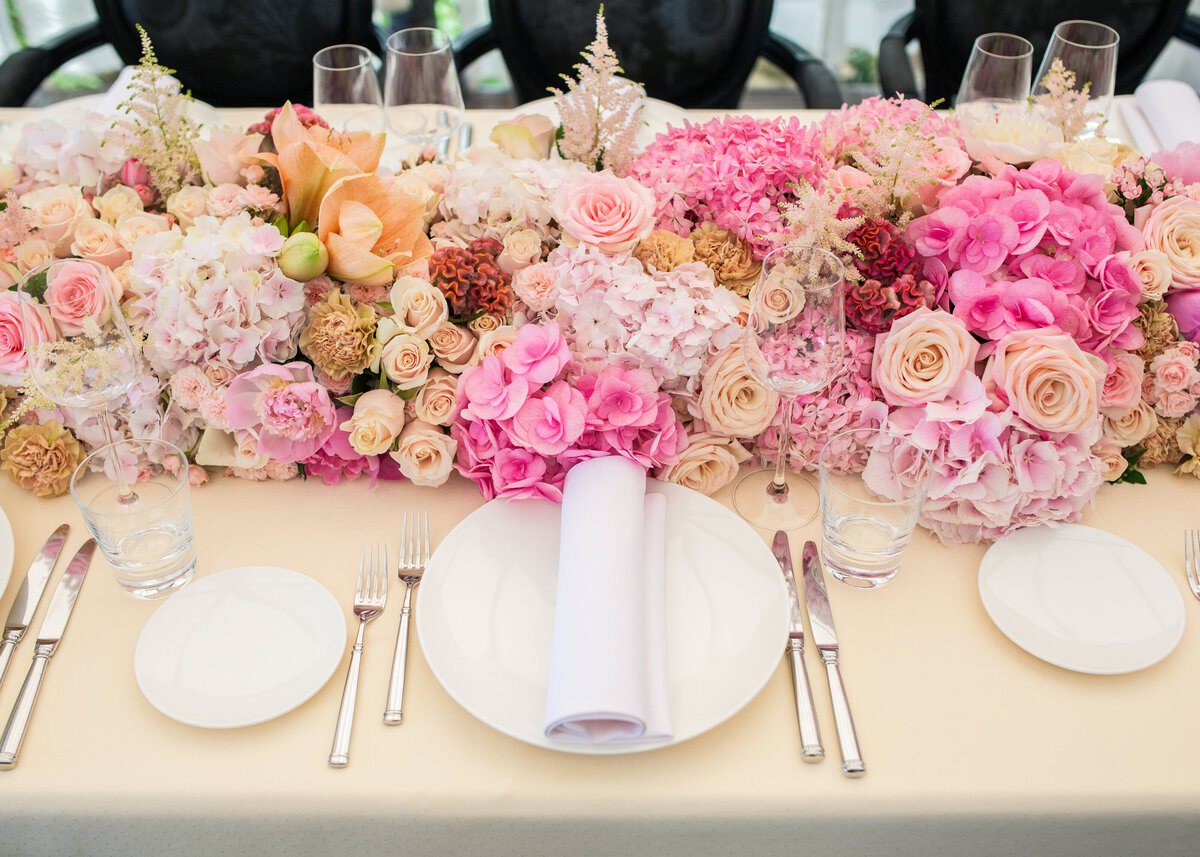 Wedding luxury table setting with beautiful ombre flowers.