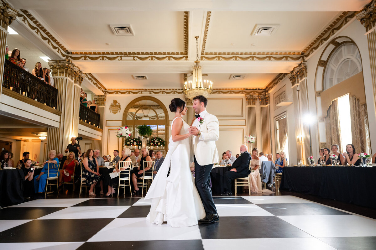 wedding couple having their first dance during their wedding reception in the grand ballroom at george washington hotel