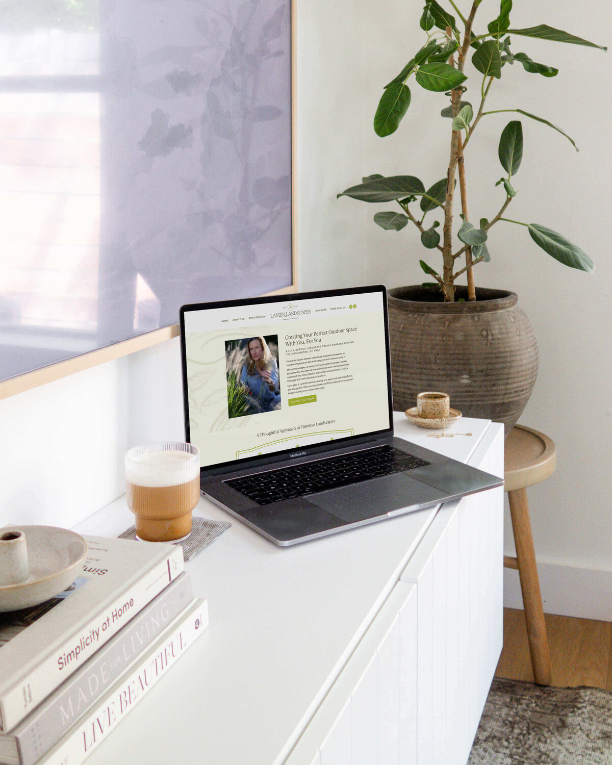 Modern website design with soft green accents and clean typography, designed for an upscale landscaping and garden business.