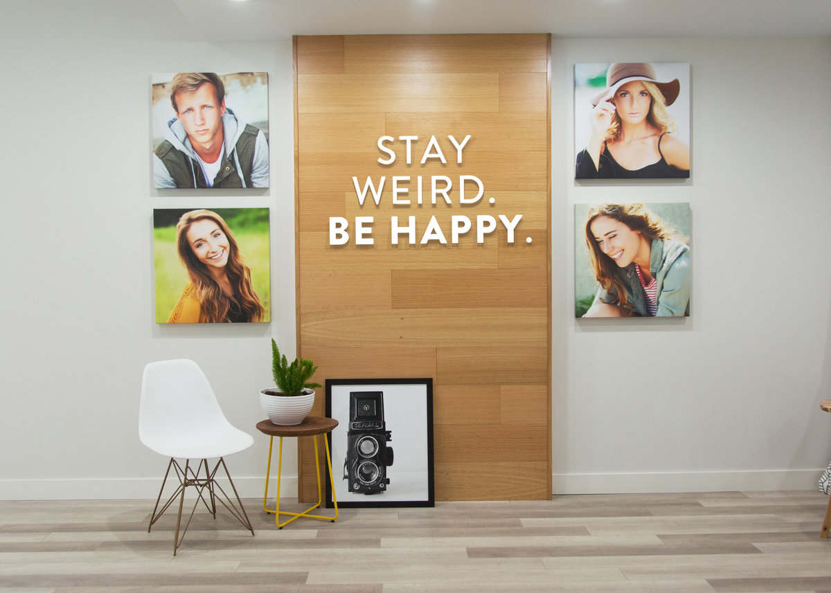 Stay Weird Be Happy Wall Display in Adam Hommerding Photography Studio