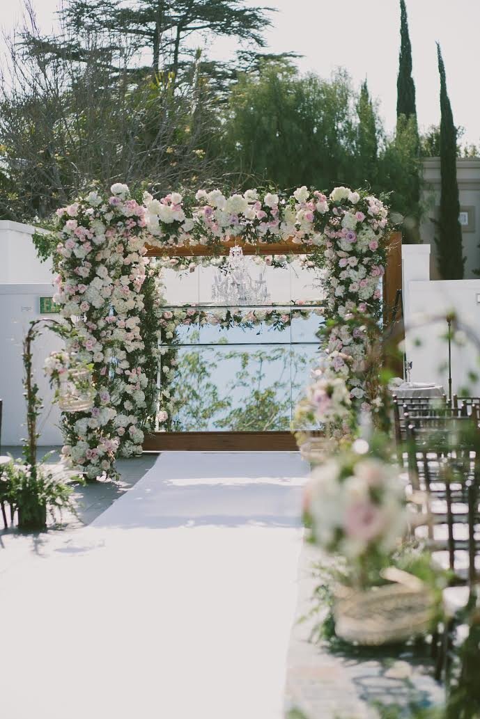Pink and White flowers on chuppah