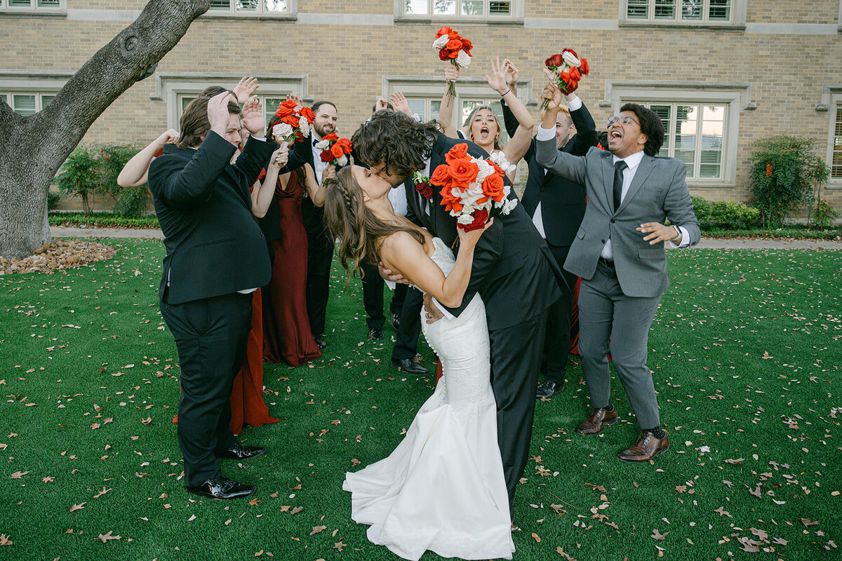 Bride and groom walk hand-in-hand through flying confetti in joyful wedding party send-off in San Antonio