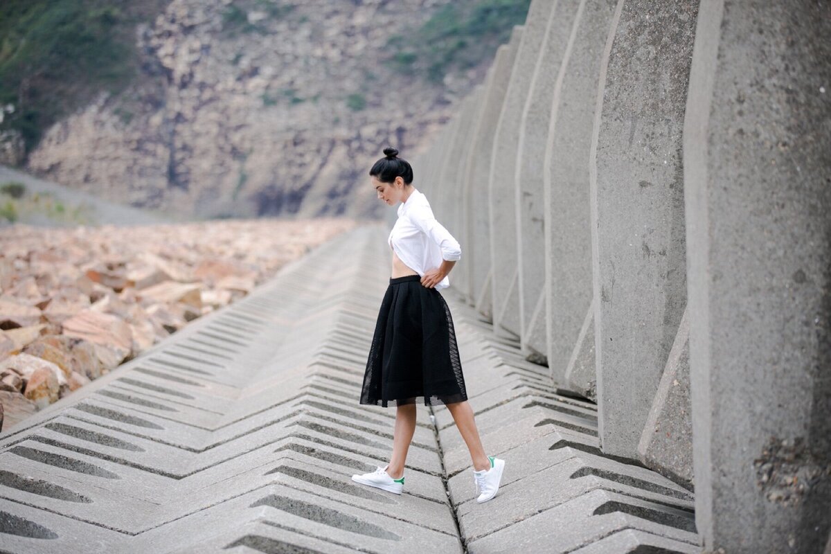 Picture of girl walking across cement blocks