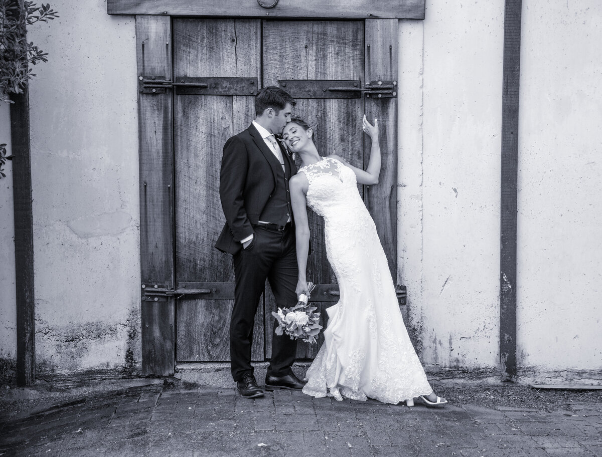 black and white romantic image of bride and groom