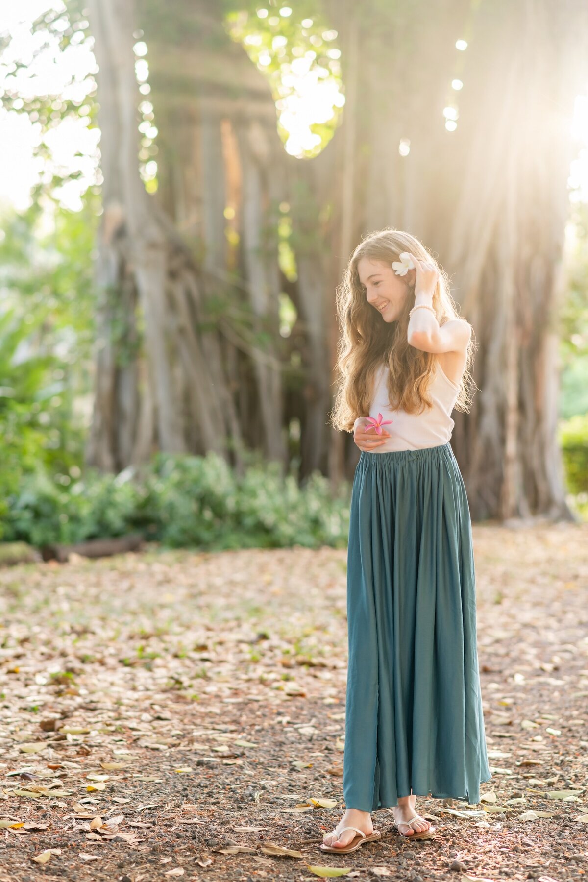 Smiling Graduate with topical forest Views – Kauai Portraits