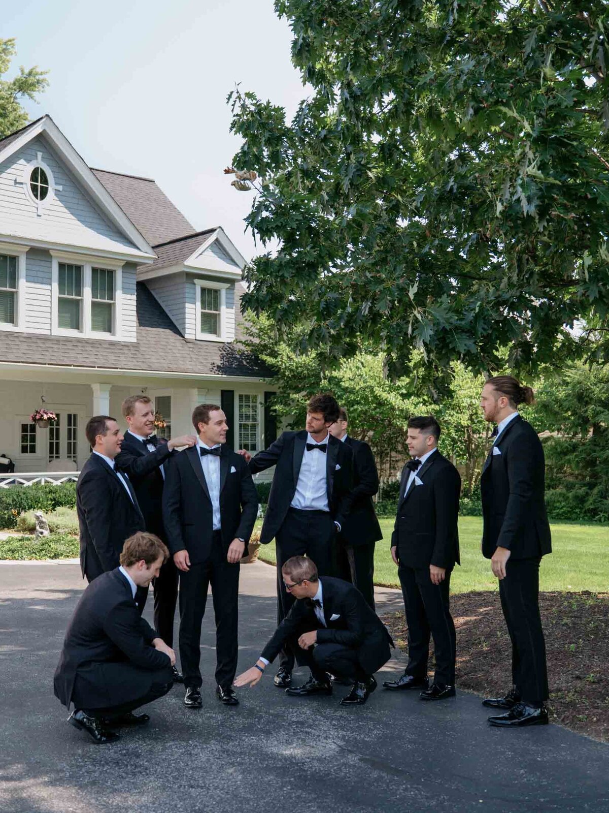 Groom with groomsmen getting ready for his Windows on the River wedding