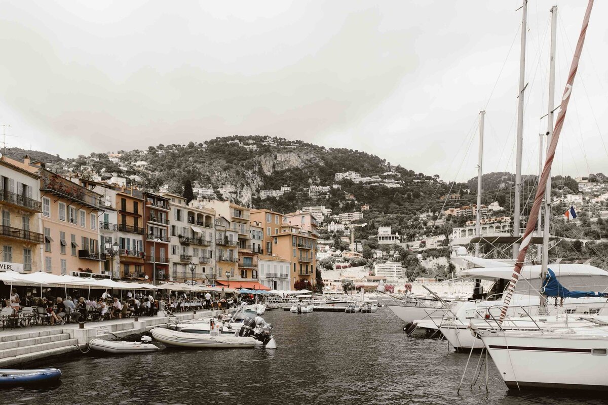 Boats at harbor of colorful bay